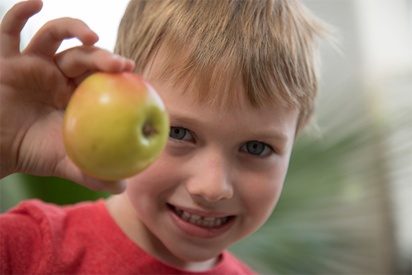 Patient holding apple