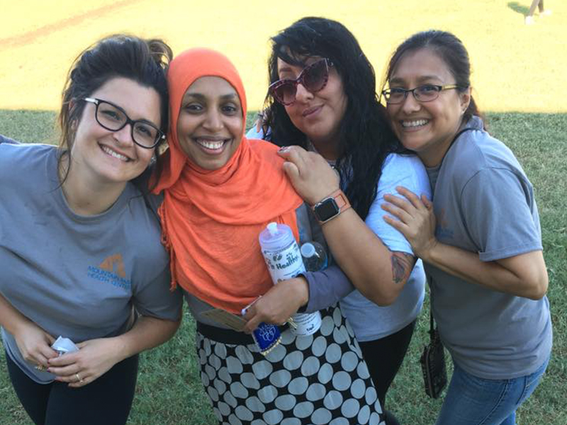 Lina with some of her coworkers at a Community Ambassador event.