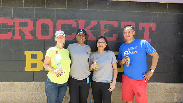 (Top) From left to right: Jennifer Kennedy, Laporsha Armstrong, Marivel Alvarez and Gregorio Montes de Oca volunteered at the Crockett Elementary Field Day.