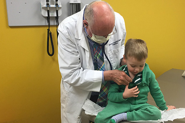 Dr. Van is doing a check up with the kid.