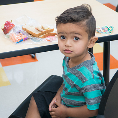 A kid participates during MPHC's summer food program